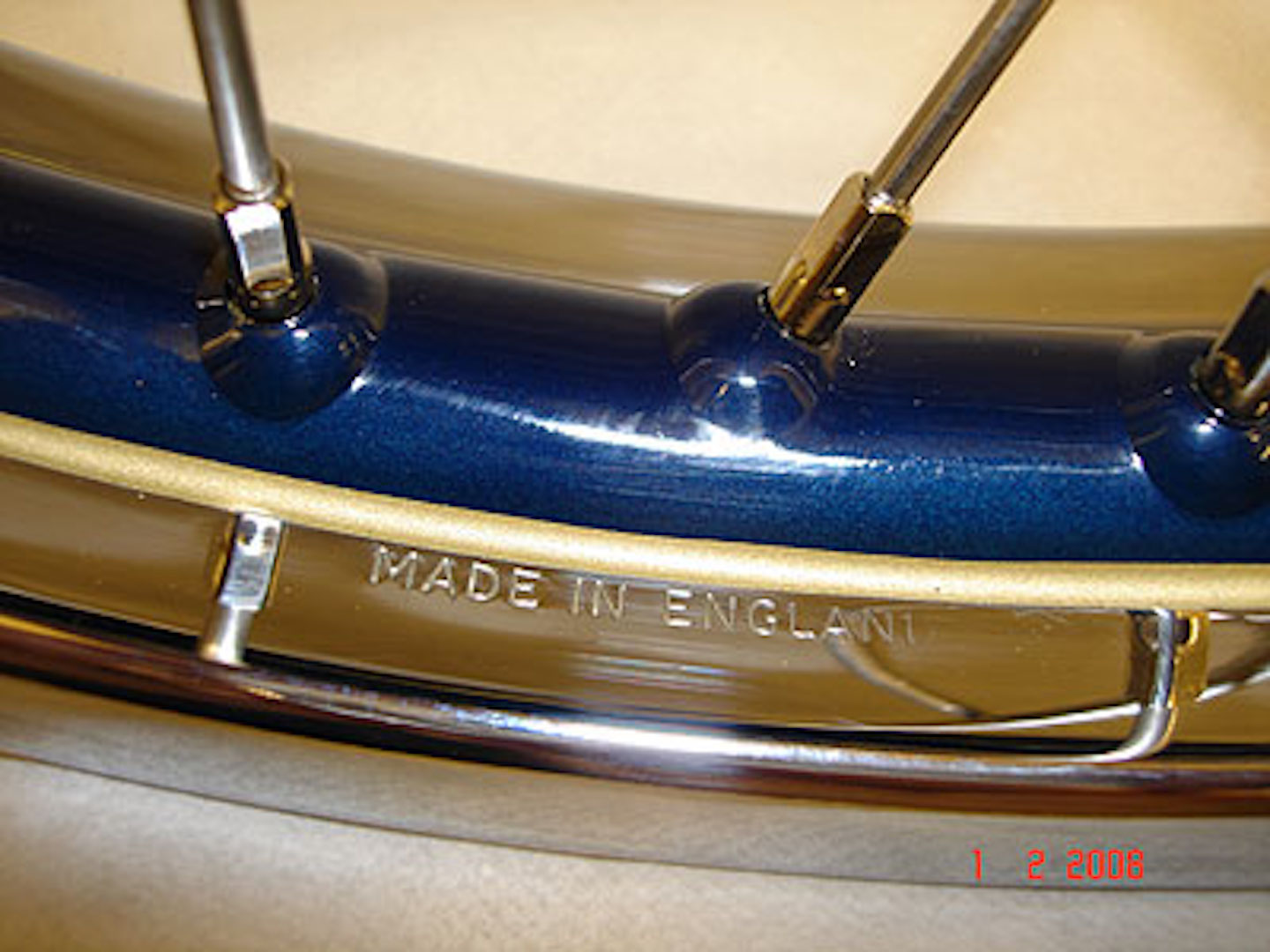 Polished steel wheel rim with blue powder coated center